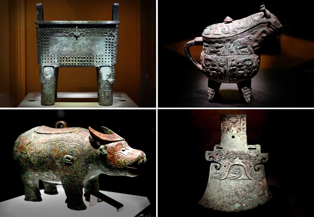 这是殷墟博物馆新馆内展出的“司母辛”铜鼎（左上）、“亚长”铜觥（右上）、“亚长”牛尊（左下）、“亚长”铜钺（拼版照片，2月23日摄）。